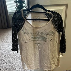 Faded Free People tee with lace sleeves.
